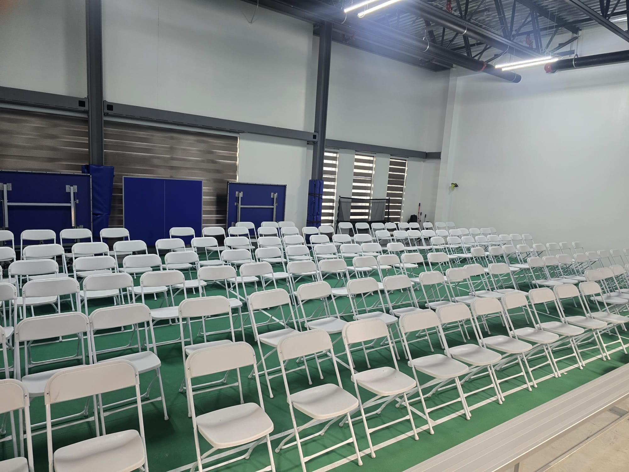 White folding chairs for indoor event - chair rentals GTA Durham Region