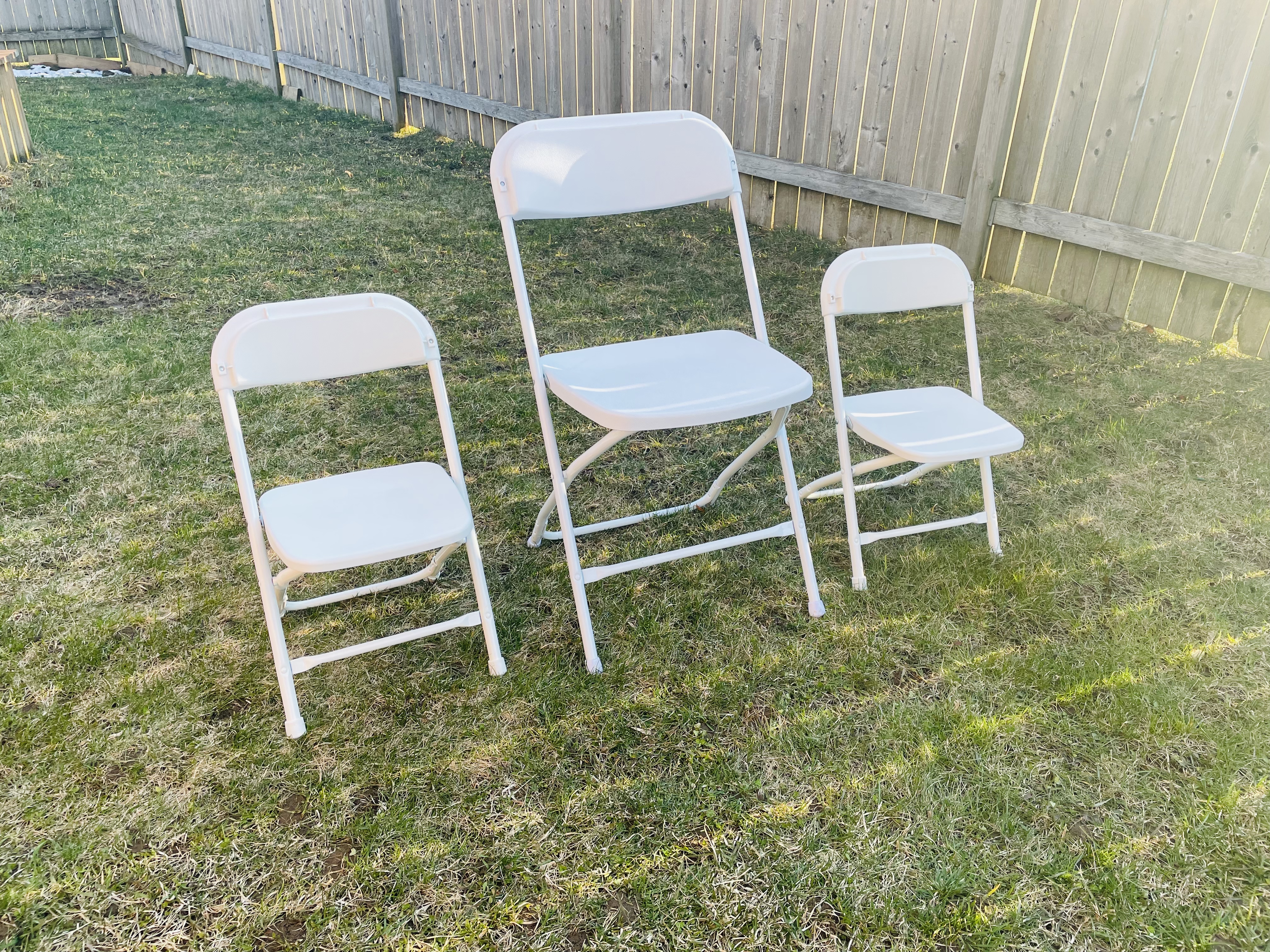 White folding chairs including kids size chairs for rent across GTA and Durham Region - Gather and Go Rentals Toronto Oshawa Whitby
